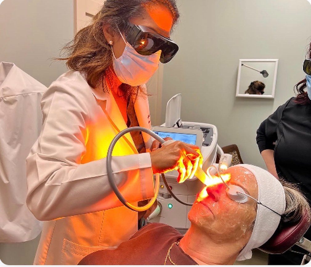 Dr. Shefali Miglani performing an IPL treatment on a patient at Monroe Eye Care